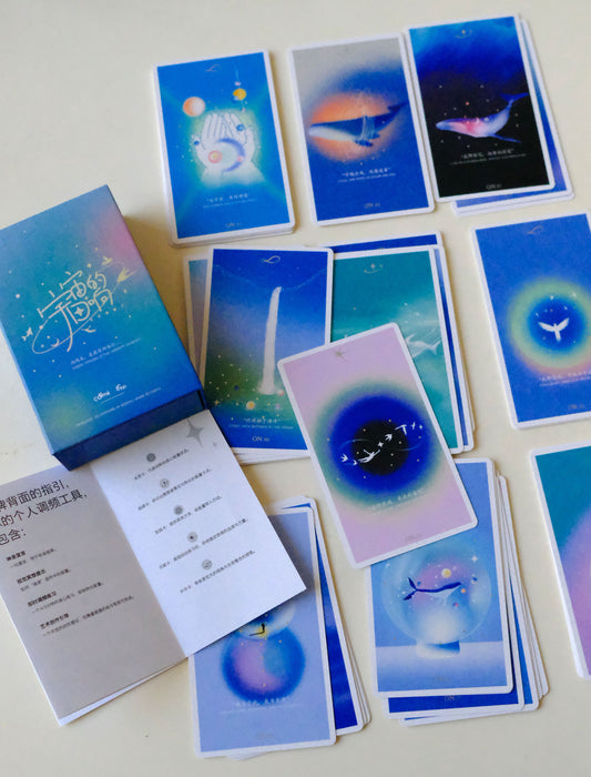 Cosmic Echo deck displayed with its illustrated cards and printed guide