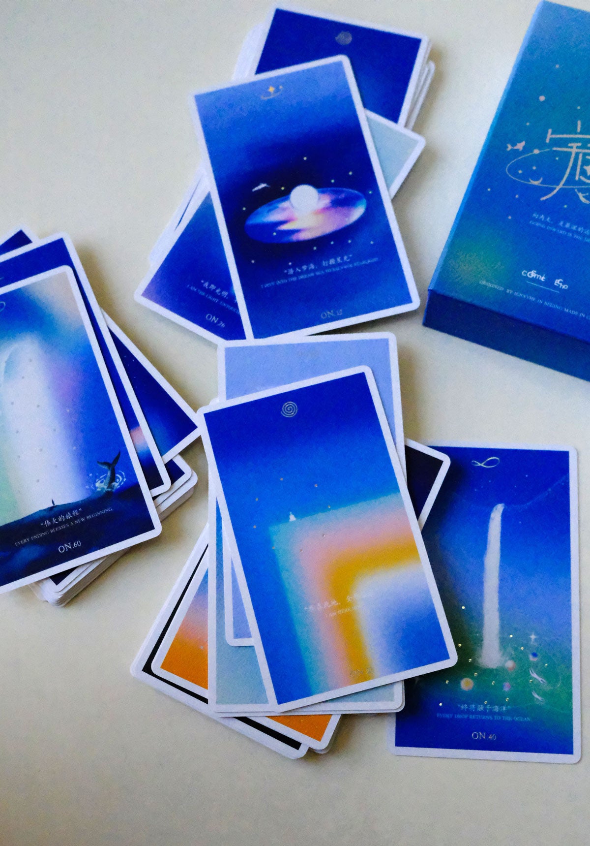 Selection of blue and pastel Cosmic Echo illustrated cards